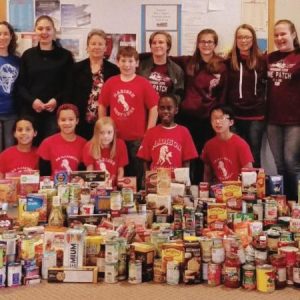Madison Mustangs Pathfinders Collect 690 Food Items for Families in Need