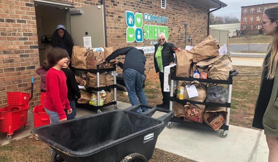 Monroe Pathfinders and Adventurers Deliver 400 Pounds of Food to Shelter